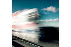 E-commerce delivery lorry moving quickly.